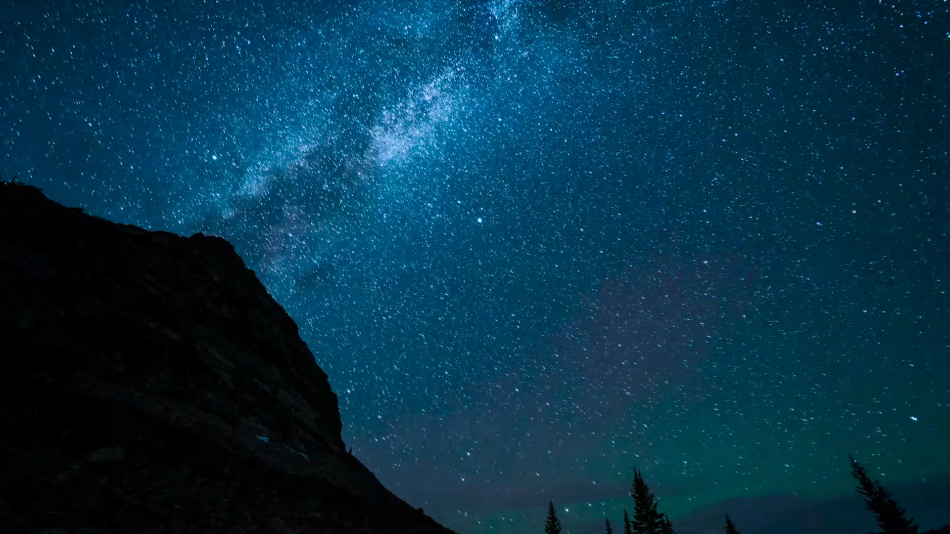 The Milky Way over a dark ridgeline